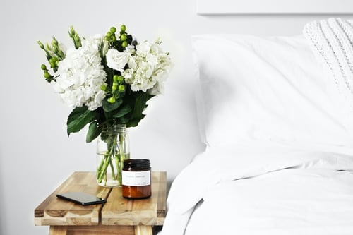 white bedding and flowers