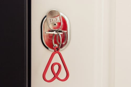 key to an apartment or house with airbnb logo keyring