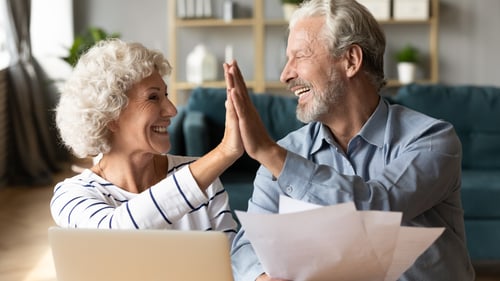 older couple high-five 