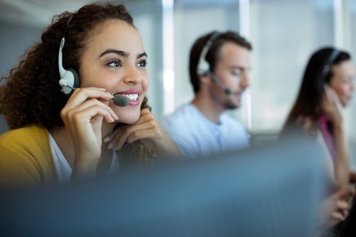 cheerful young woman answers customer support line