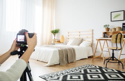 Architect making a photo of interior arrangement in eco style